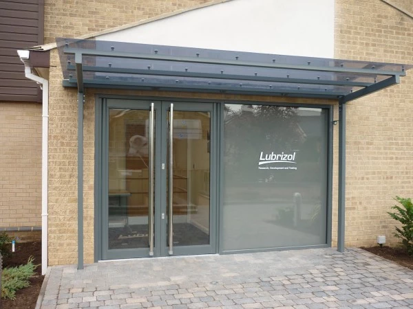 Grey entrance canopy at a commercial building