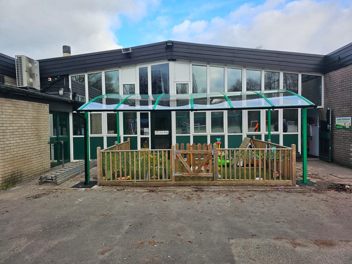 Curved early-years canopy at a school