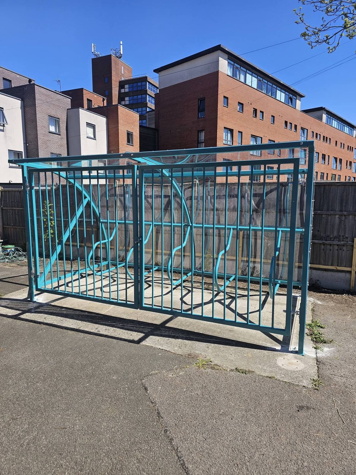 Cycle shelter with security gates, Hideaway Youth Project, Manchester, installed by Canopies & Shelters Ltd