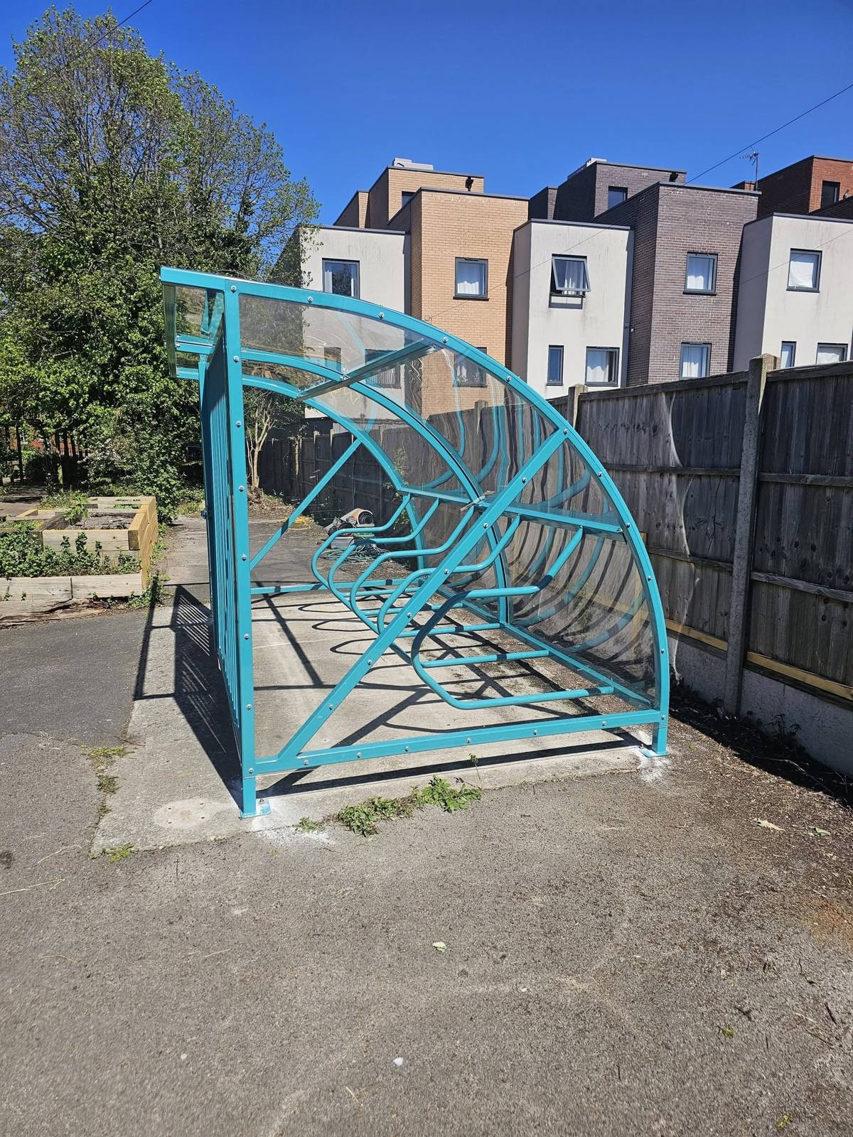 Cycle shelter with security gates, Hideaway Youth Project, Manchester, installed by Canopies & Shelters Ltd