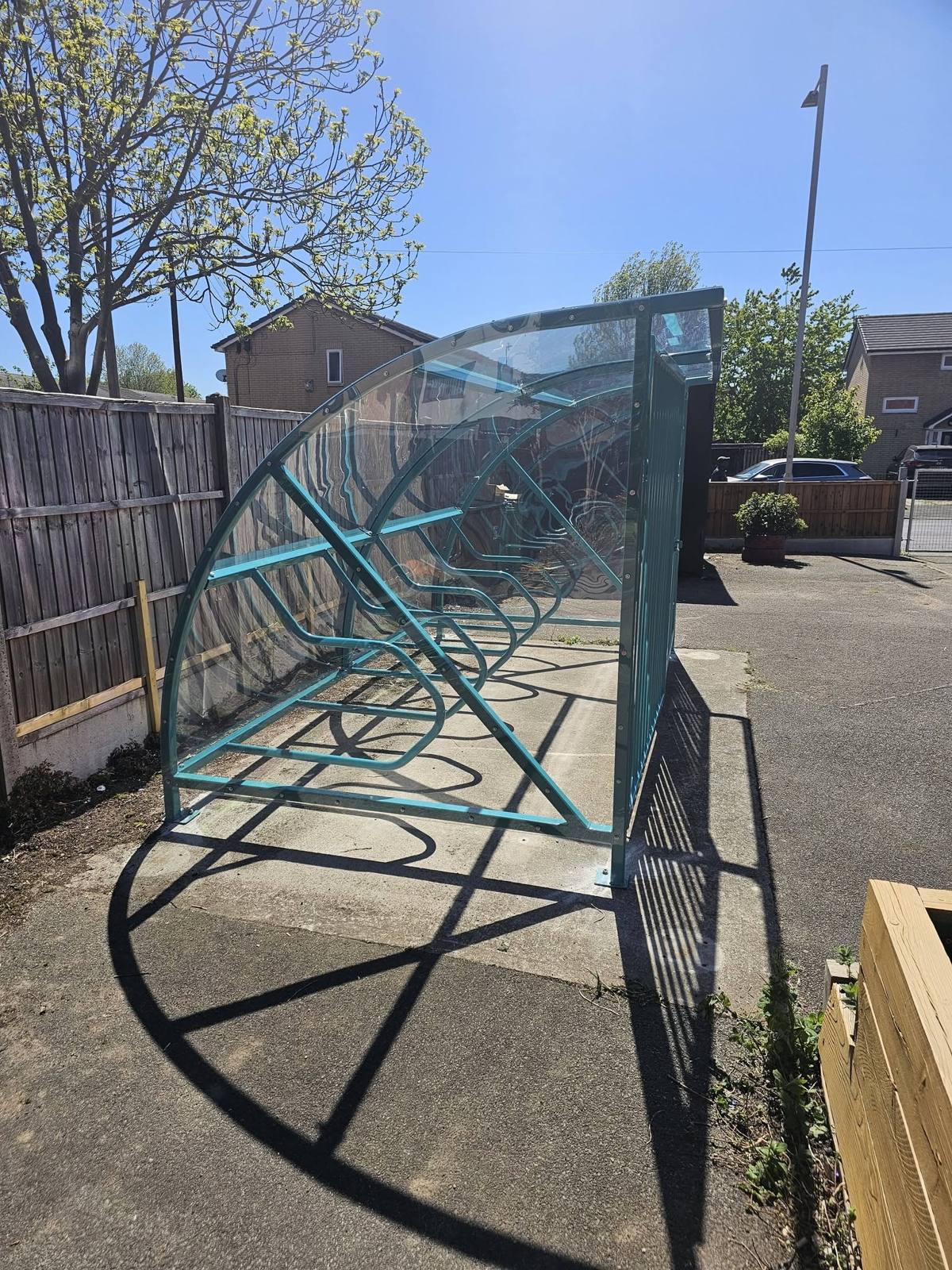 Cycle shelter with security gates, Hideaway Youth Project, Manchester, installed by Canopies & Shelters Ltd
