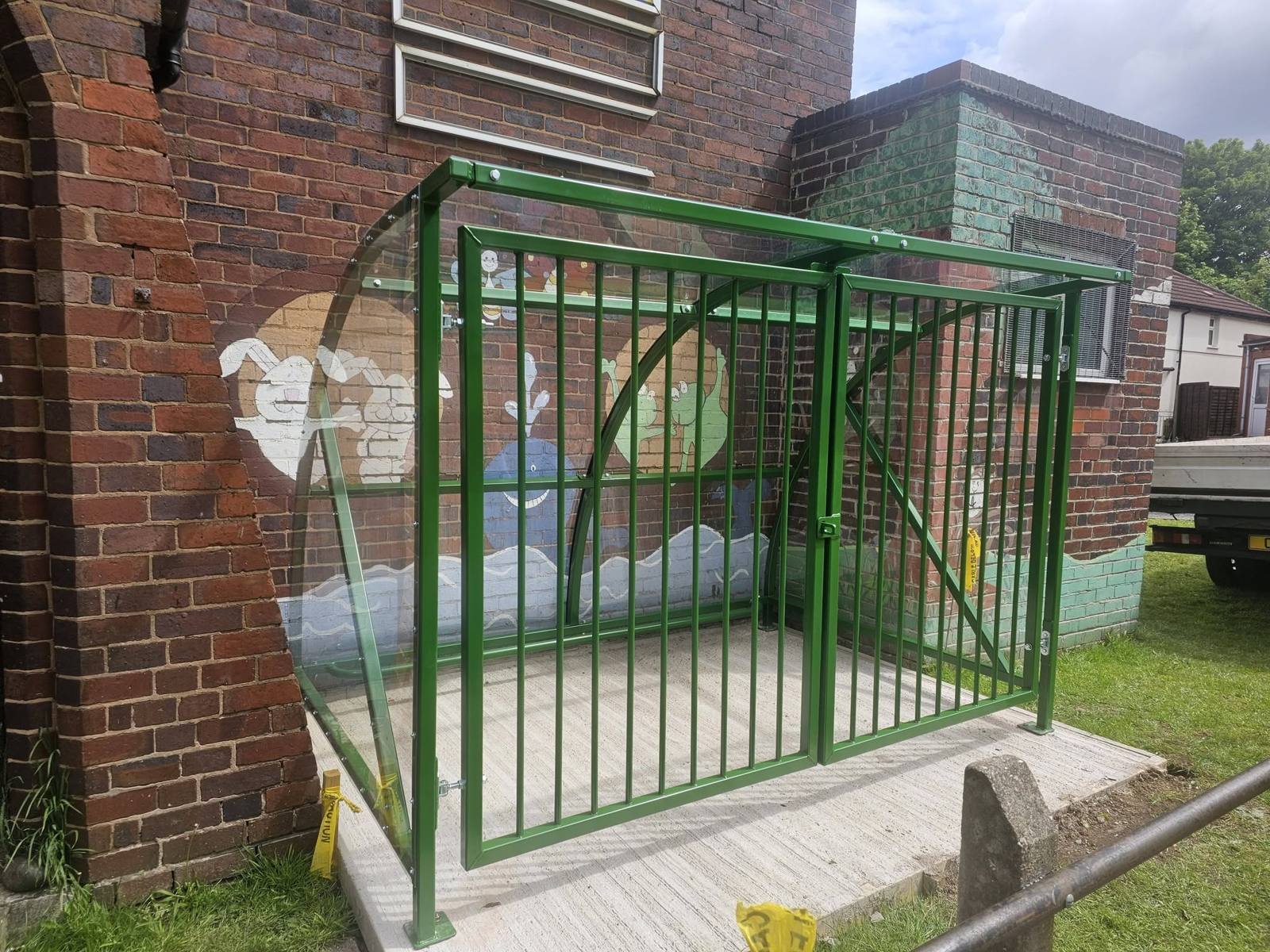 Buggy shelter with security gates, New Beginnings Creative, Birmingham, installed by Canopies & Shelters Ltd